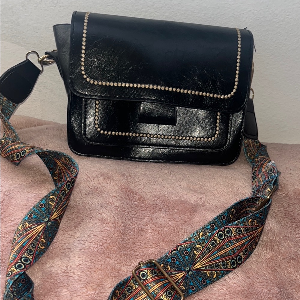 Sleek Black Crossbody Bag with Glossy Finish and Silver Hardware